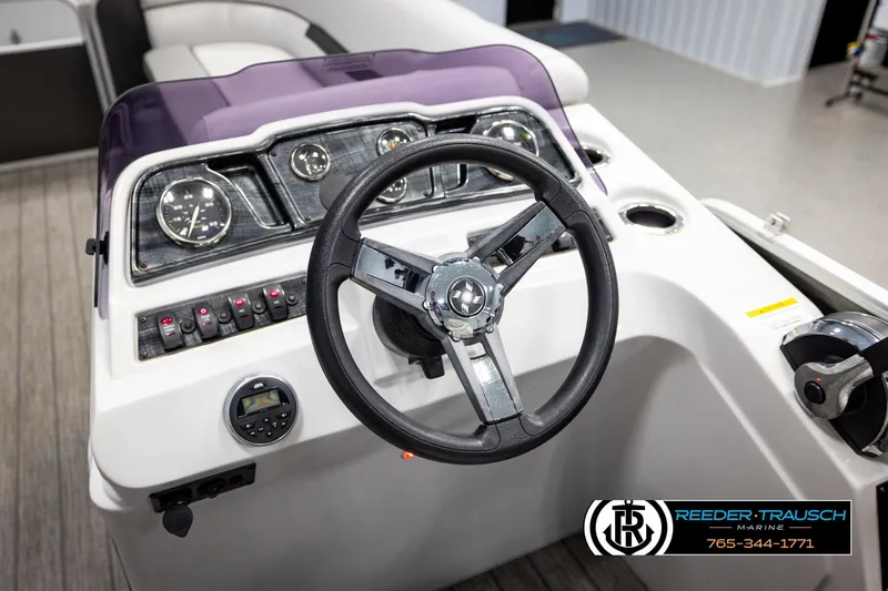 Slide: The Image of 2019 Sweetwater SW2086c boat dashboard with steering wheel and control panel. - 25