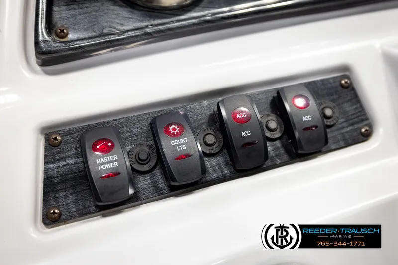 Slide: The Image of Control panel of a 2019 Sweetwater SW2086c boat with labeled switches. - 28