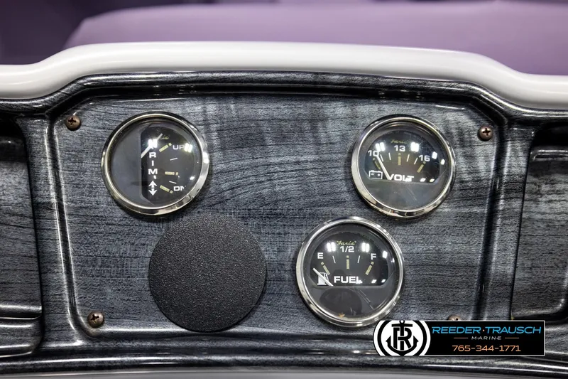 Slide: The Image of Dashboard of a 2019 Sweetwater SW2086c boat with fuel and volt gauges. - 30