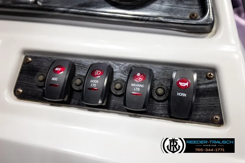 Slide: The Image of Control panel of a 2019 Sweetwater SW2086c boat with labeled switches. - 33