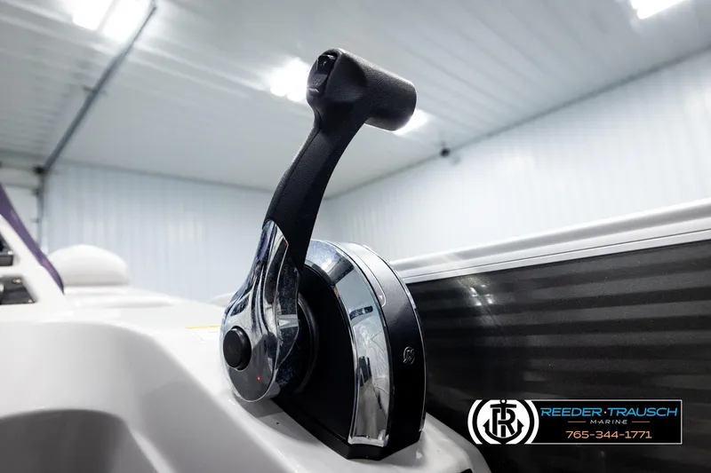 Slide: The Image of Close-up of Sweetwater SW2086c 2019 boat throttle control in a showroom. - 34