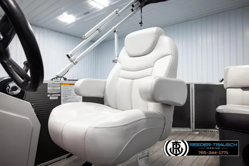 Slide: The Image of White captain's chair on 2019 Sweetwater SW2086c boat, indoor setting, Reeder-Trausch Marine logo visible. - 35