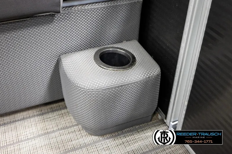Slide: The Image of Gray textured cup holder in a 2019 Sweetwater SW2086c boat interior. - 38