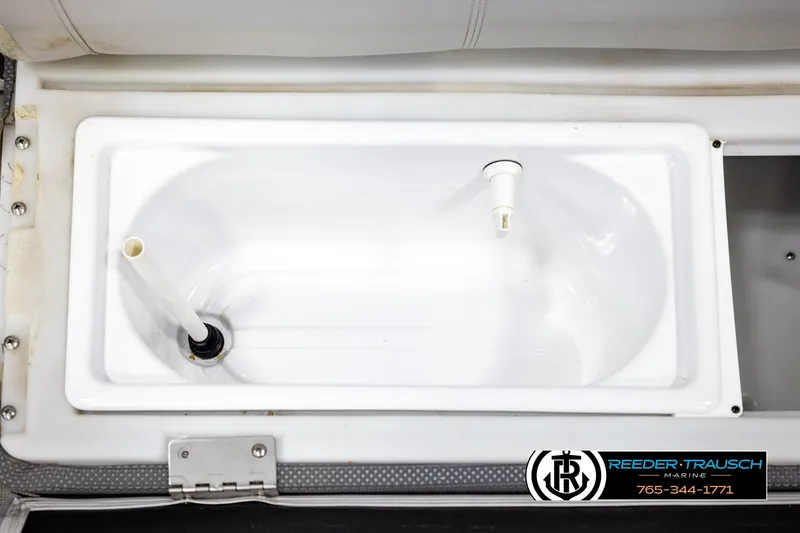 Slide: The Image of 2019 Sweetwater SW2086c boat livewell with white interior and drainage system. - 40