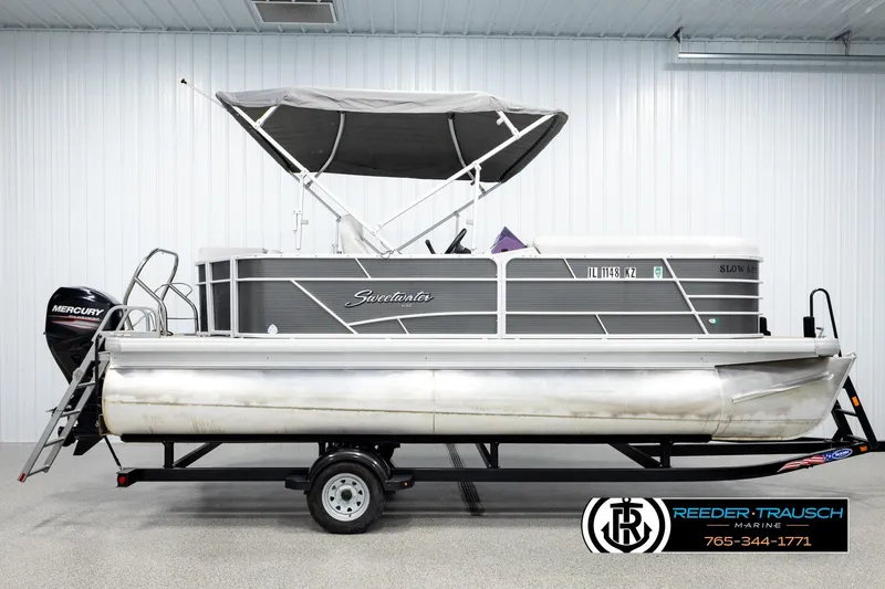 Slide: The Image of 2019 Sweetwater SW2086c pontoon boat with Mercury engine in indoor showroom. - 5