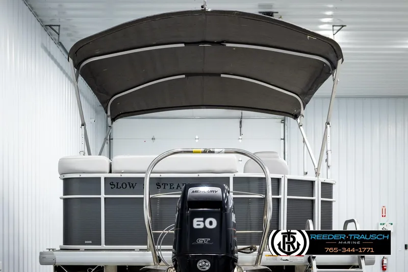 Slide: The Image of 2019 Sweetwater SW2086c pontoon boat with Mercury 60 engine in indoor storage. - 7