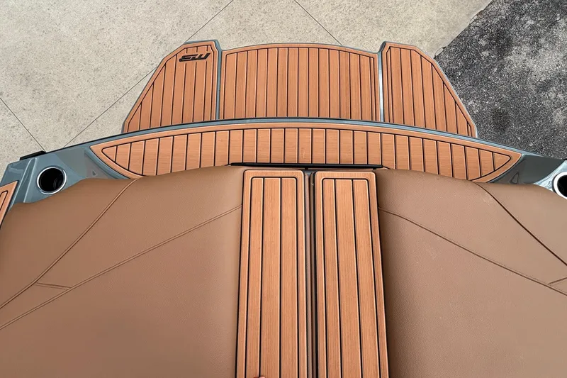 Slide: The Image of 2026 MB B52 23 Classic boat deck with sleek brown and wood finish. - 11