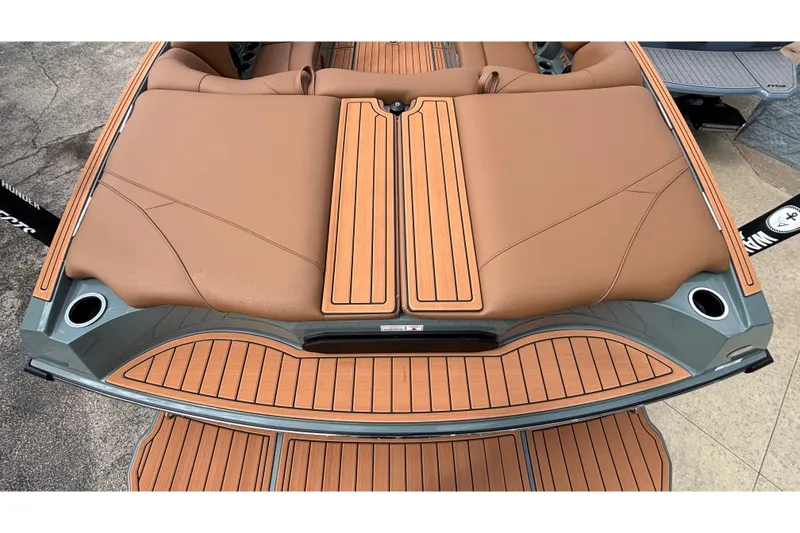 Slide: The Image of 2026 MB B52 23 Classic boat with tan leather seating and wood-style deck. - 12