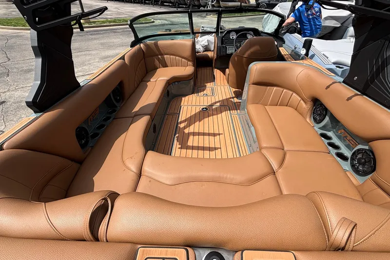 Slide: The Image of Interior of 2026 MB B52 23 Classic boat with tan leather seating and wood flooring. - 14