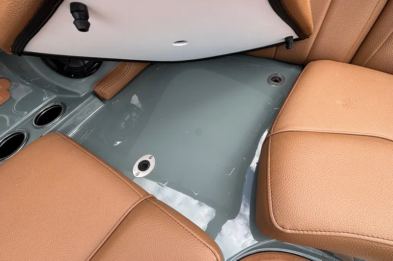 Slide: The Image of 2026 MB B52 23 Classic boat interior with tan leather seats and cup holders. - 18