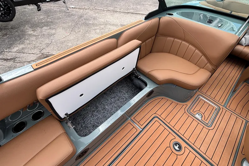 Slide: The Image of 2026 MB B52 23 Classic boat interior with tan seating and storage compartment. - 21