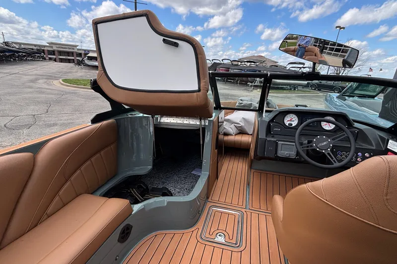 Slide: The Image of Interior of 2026 MB B52 23 Classic boat with tan seating and modern dashboard. - 22