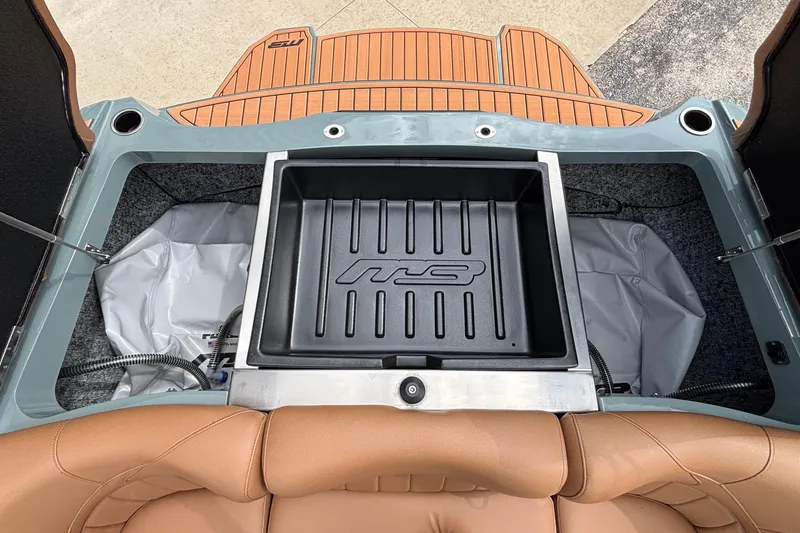 Slide: The Image of 2026 MB B52 23 Classic boat interior with storage compartment and tan seating. - 32