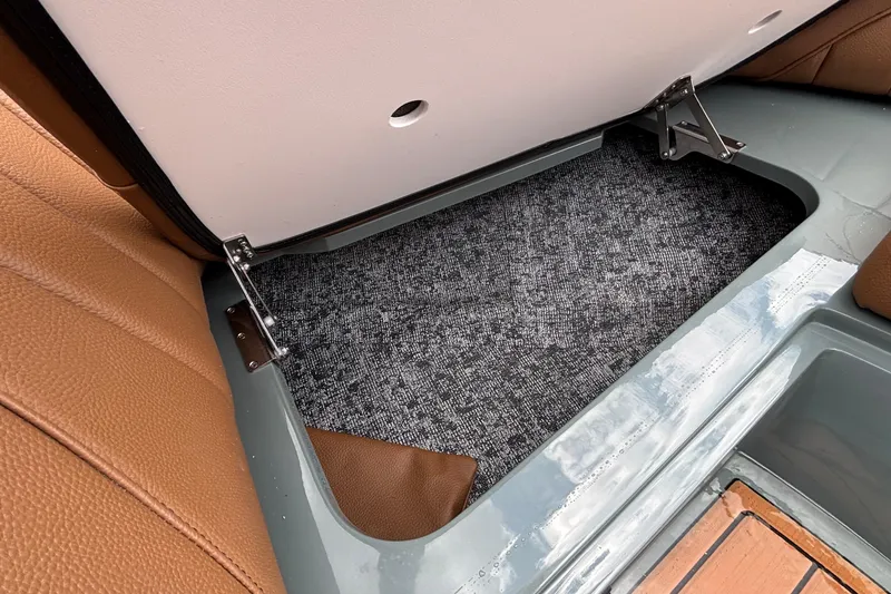 Slide: The Image of Storage compartment in 2026 MB B52 23 Classic boat with brown leather seating. - 38