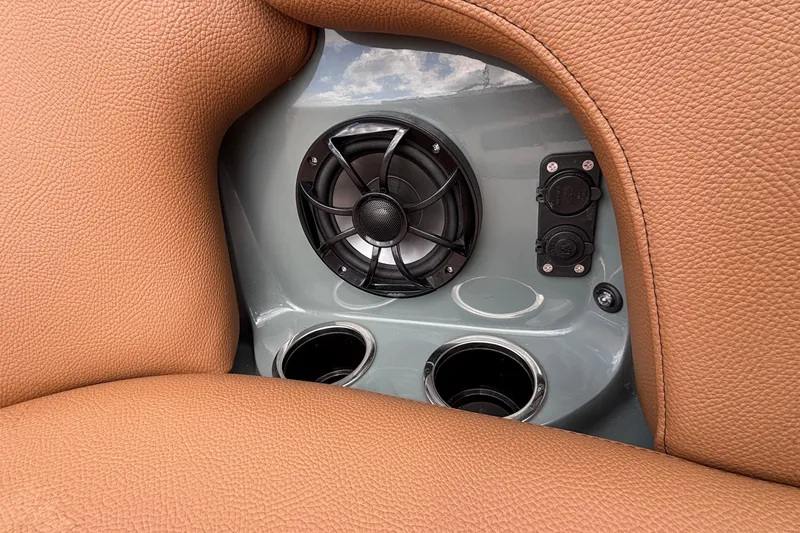 Slide: The Image of 2026 MB B52 23 Classic interior detail with speaker, cup holders, and brown leather upholstery. - 40