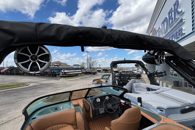 Slide: The Image of 2026 MB B52 23 Classic boat with luxury interior and speakers, displayed at a dealership. - 45