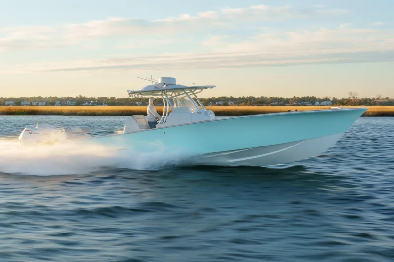 Slide: The Image of 2018 Tribute 37 boat speeding on water, scenic background. - 3