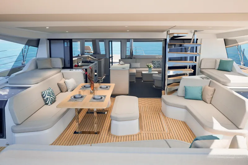 Slide: The Image of Luxurious 2026 Fountaine Pajot 55 yacht interior with elegant seating and dining area. - 44