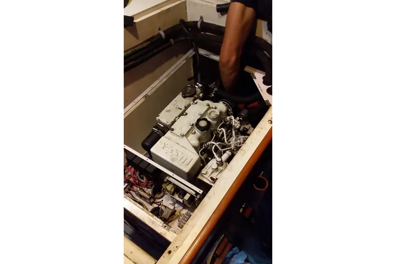 Slide: The Image of Engine compartment of a 1980 Nordic 44 sailboat with visible mechanical components. - 15