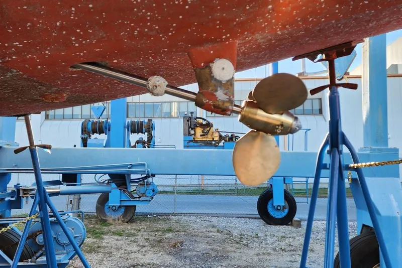 Slide: The Image of Underwater view of Nordic 44 sailboat propeller, 1980 model, on a blue boat lift. - 16