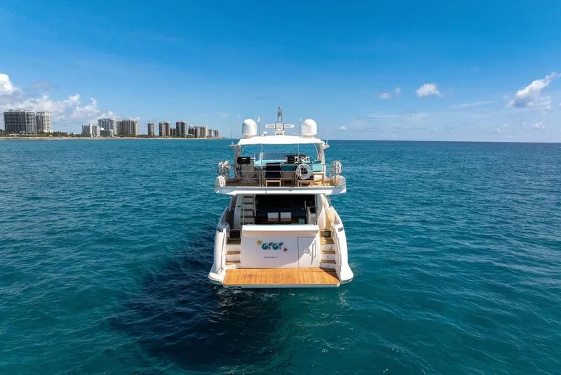 Slide: The Image of Azimut 70 yacht from 2011 on open sea with city skyline in background. - 104