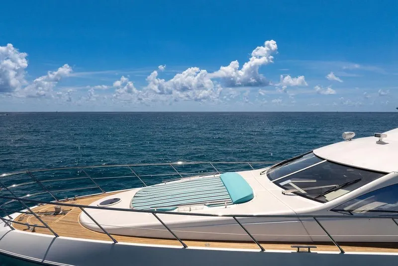 Slide: The Image of Luxury Azimut 70 yacht cruising on open sea under clear blue sky. - 106