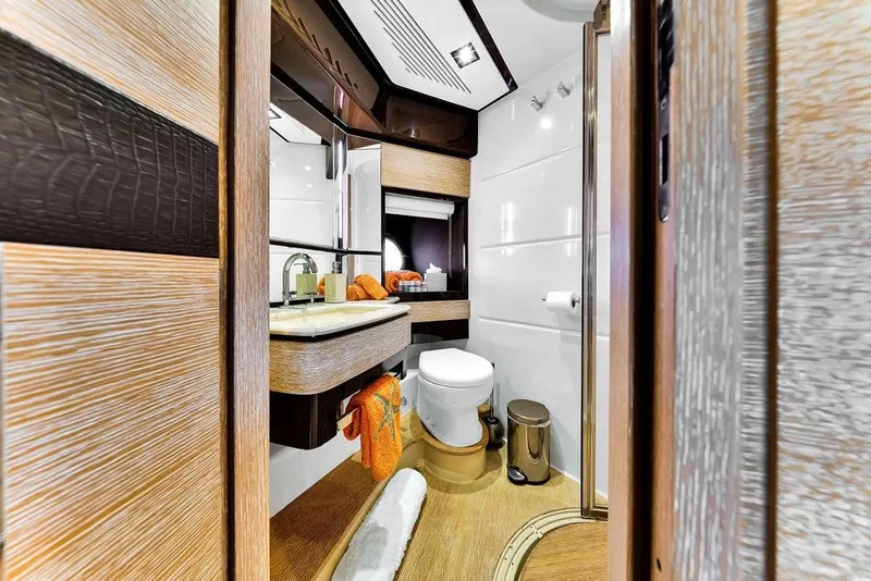 Slide: The Image of Luxurious bathroom interior of 2011 Azimut 70 yacht with modern fixtures and wood accents. - 91