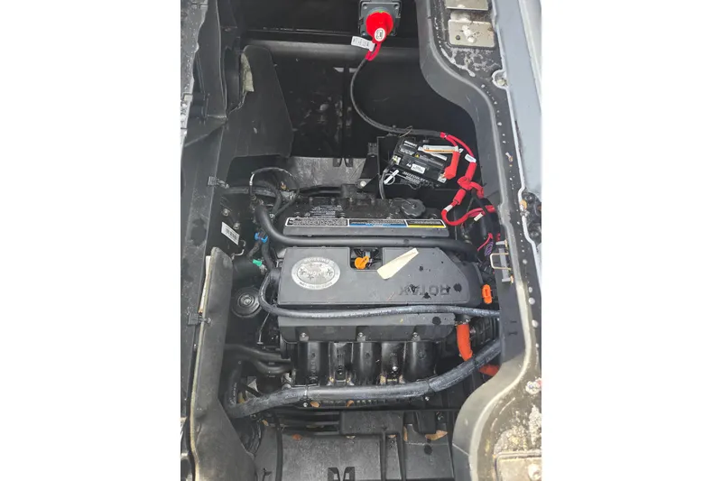 Slide: The Image of 2024 Sea-Doo Switch Cruise 21 engine compartment with visible components and wiring. - 10