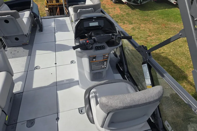 Slide: The Image of 2024 Sea-Doo Switch Cruise 21 interior with steering console and seating arrangement. - 13