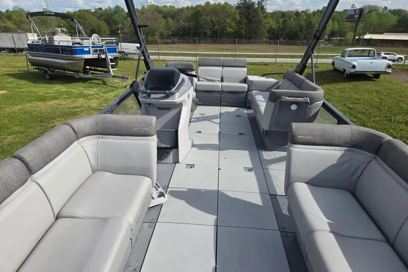 Slide: The Image of 2024 Sea-Doo Switch Cruise 21 pontoon boat interior with spacious seating and modern design. - 17