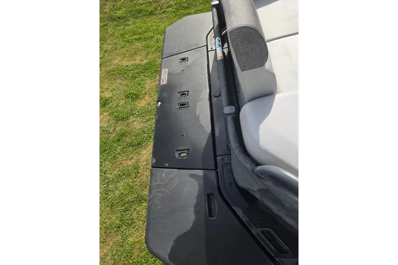 Slide: The Image of 2024 Sea-Doo Switch Cruise 21 deck and seating detail on grass. - 9