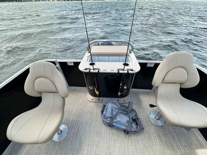 Slide: The Image of Starcraft EX 20 FD boat with two seats and fishing rods. - 3