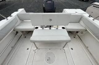 Slide: The Image of 2019 Striper 230 DC boat interior with seating and storage compartments. - 12