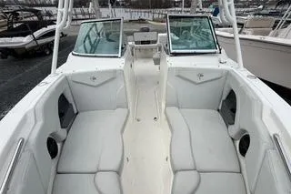 Slide: The Image of 2019 Striper 230 DC boat interior with white seating and dual consoles. - 20