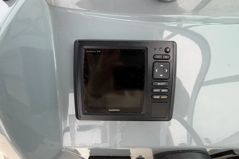Slide: The Image of Garmin echomap CV on 2019 Striper 230 DC boat dashboard, featuring navigation controls. - 21