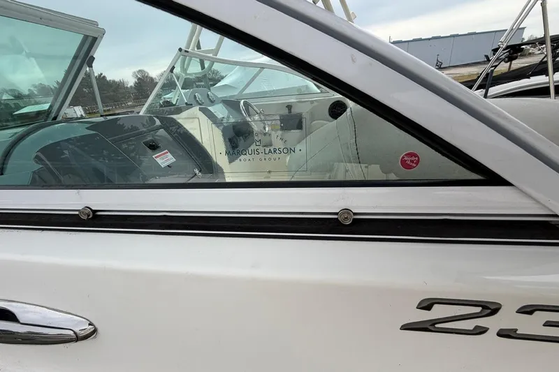 Slide: The Image of 2019 Striper 230 DC boat side view with interior details visible. - 24