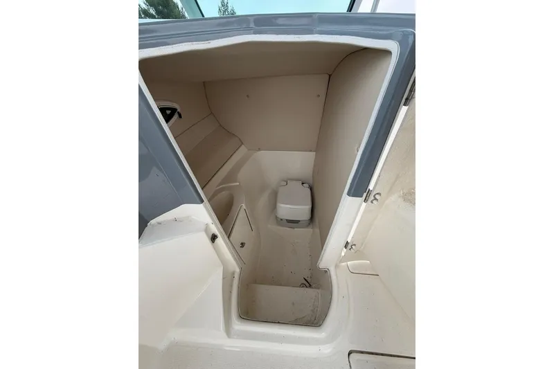 Slide: The Image of Interior cabin of a 2019 Striper 230 DC boat, featuring compact design and amenities. - 30