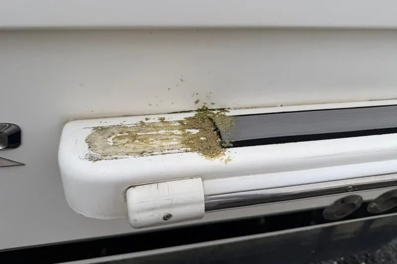 Slide: The Image of 2019 Striper 230 DC boat with algae growth on the surface. - 36