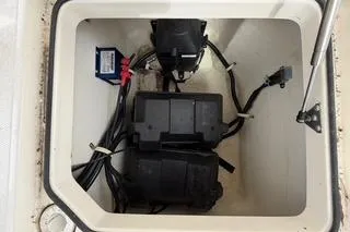 Slide: The Image of Battery compartment of 2019 Striper 230 DC boat with wiring and components. - 38