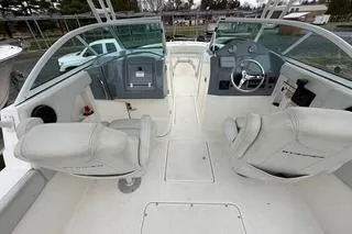 Slide: The Image of 2019 Striper 230 DC boat interior with dual consoles and seating. - 6
