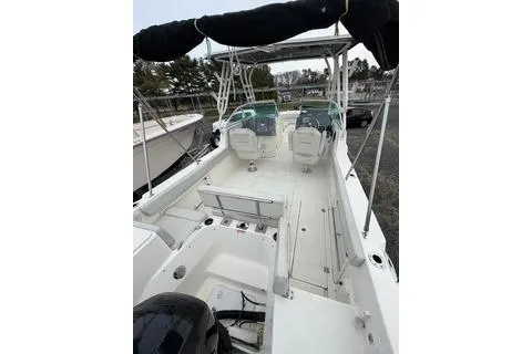 Slide: The Image of 2019 Striper 230 DC boat interior with dual consoles and seating, featuring a sleek design. - 8