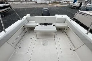 Slide: The Image of 2019 Striper 230 DC boat interior with spacious seating and clean deck. - 9