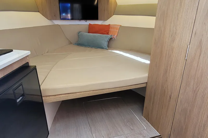 Slide: The Image of Interior cabin of 2023 NX Boats NX340 with cozy seating and modern design. - 19