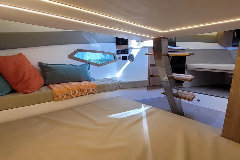 Slide: The Image of Luxurious interior of 2023 NX Boats NX340, featuring cozy seating and modern design elements. - 23