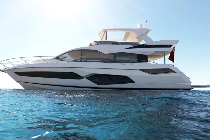 The Image of 2021 Sunseeker Manhattan 68 yacht on clear blue water under a bright sky. - 0