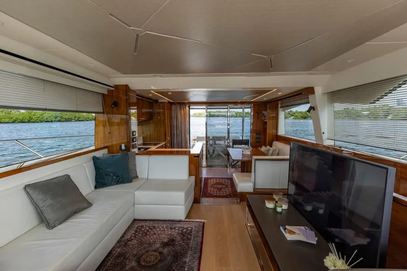 Slide: The Image of Luxurious interior of 2021 Sunseeker Manhattan 68 yacht with elegant seating and scenic water views. - 108