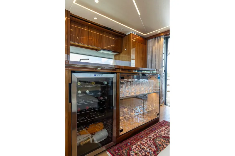 Slide: The Image of Luxurious interior of 2021 Sunseeker Manhattan 68 yacht with wine cooler and glass cabinet. - 112