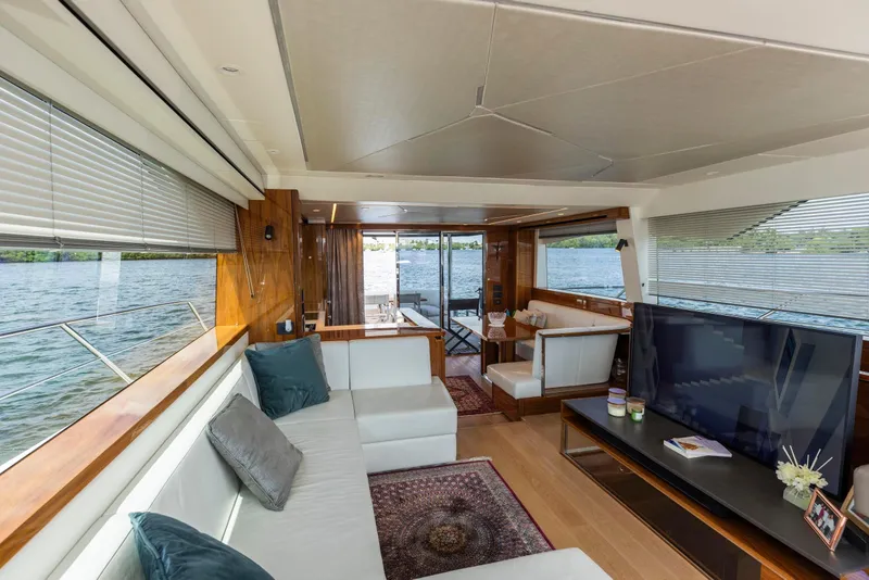 Slide: The Image of Luxurious interior of 2021 Sunseeker Manhattan 68 yacht with elegant furnishings and scenic water views. - 115