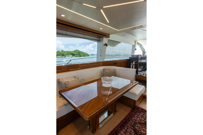Slide: The Image of Luxurious interior of 2021 Sunseeker Manhattan 68 yacht with elegant dining area and scenic view. - 116