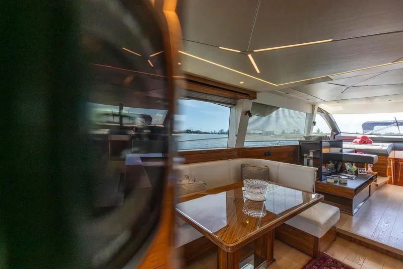 Slide: The Image of Luxurious interior of 2021 Sunseeker Manhattan 68 yacht with elegant seating and panoramic windows. - 119